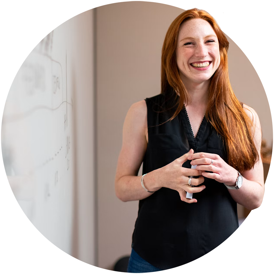 An internal expert teaching in front of a whiteboard
